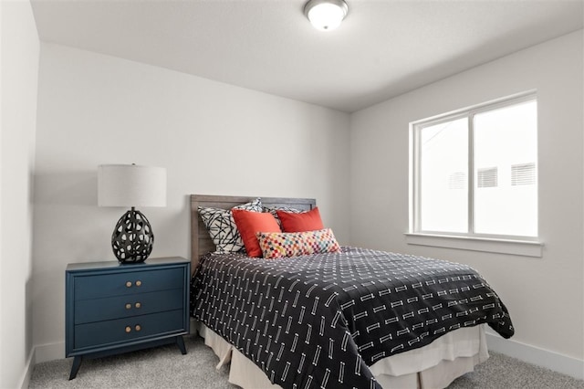 bedroom with carpet and baseboards