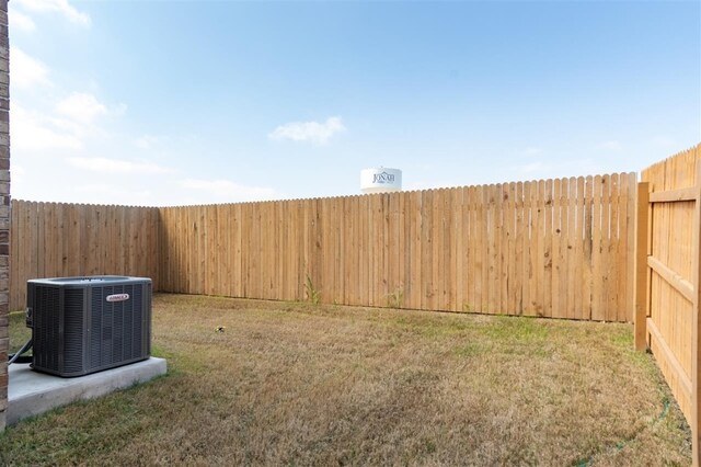 view of yard featuring central air condition unit