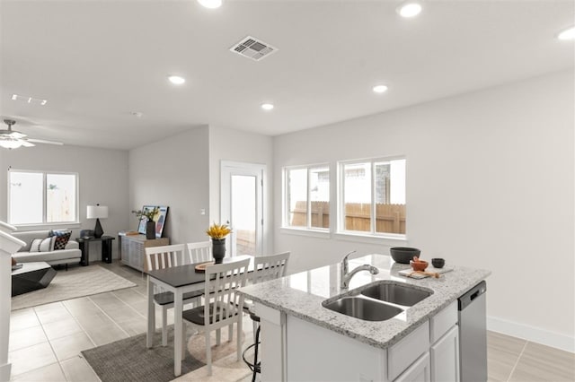 kitchen featuring a sink, stainless steel dishwasher, recessed lighting, a kitchen island with sink, and ceiling fan