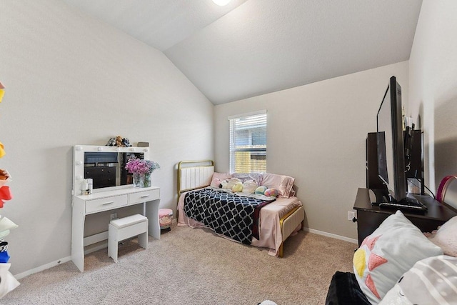 carpeted bedroom featuring lofted ceiling