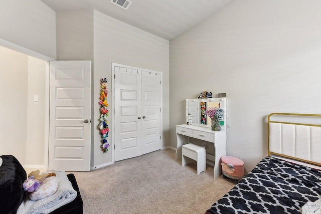 bedroom featuring a closet, carpet, vaulted ceiling, and visible vents