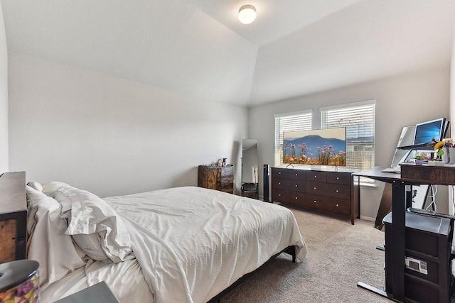 bedroom featuring light carpet and lofted ceiling