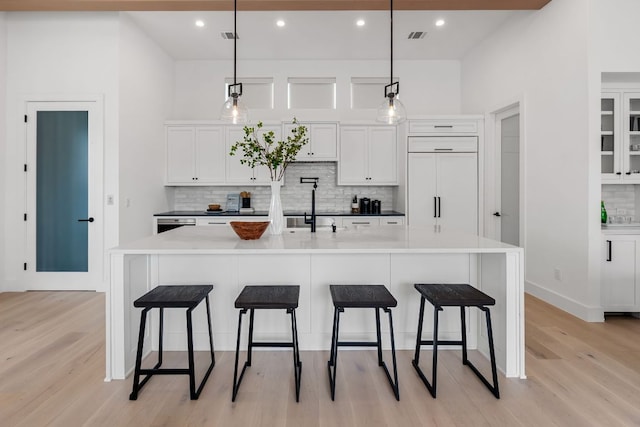 13408 Galleria Cir, Austin, TX 78738 - kitchen featuring a sink, light wood finished floors, tasteful backsplash, and recessed lighting