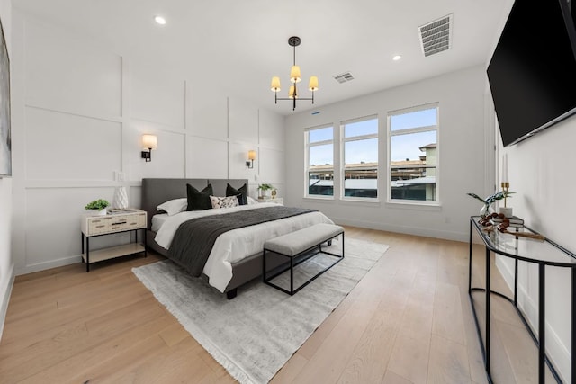 13408 Galleria Cir, Austin, TX 78738 - bedroom featuring a chandelier, light wood-type flooring, recessed lighting, and baseboards