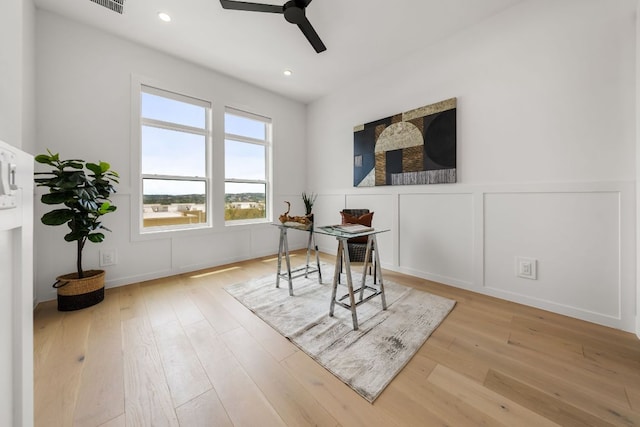 13408 Galleria Cir, Austin, TX 78738 - dining room featuring an office area, ceiling fan, a decorative wall, a wainscoted wall, and wood finished floors