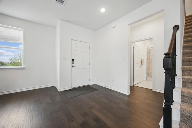 403 Stinchcomb Rd, Hutto, TX 78634 - entrance foyer with stairs, dark wood-style flooring, and recessed lighting