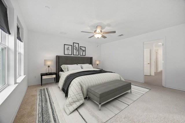 403 Stinchcomb Rd, Hutto, TX 78634 - bedroom with light carpet and a ceiling fan