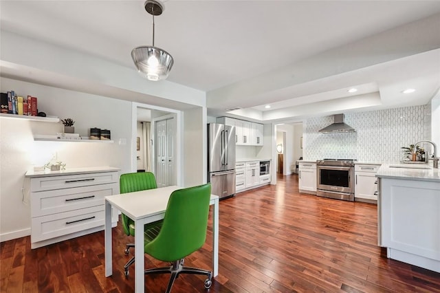 dining space featuring dark wood-style flooring and recessed lighting