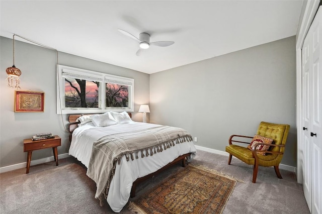bedroom with a closet, carpet floors, and baseboards