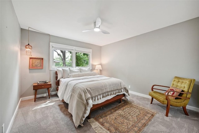 bedroom featuring carpet, baseboards, and ceiling fan