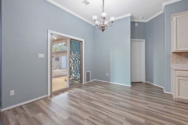 15835 Garrison Cir, Austin, TX 78717 - unfurnished dining area featuring a chandelier, light wood finished floors, and ornamental molding