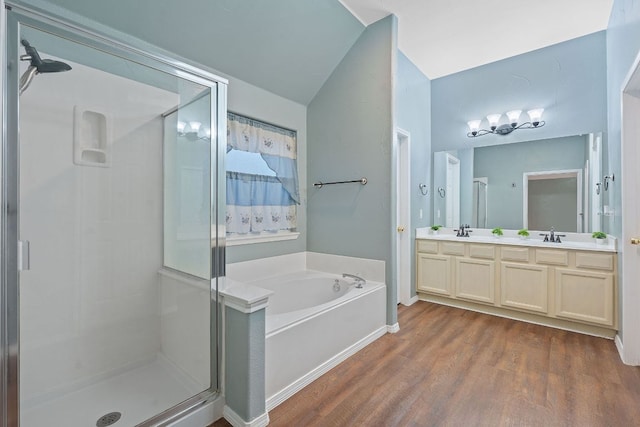 15835 Garrison Cir, Austin, TX 78717 - full bath with a stall shower, a bath, double vanity, and wood finished floors
