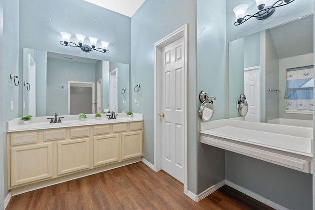 15835 Garrison Cir, Austin, TX 78717 - full bathroom featuring wood finished floors, double vanity, and baseboards
