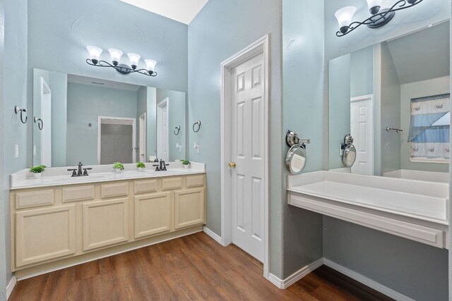15835 Garrison Cir, Austin, TX 78717 - bathroom with wood finished floors and double vanity