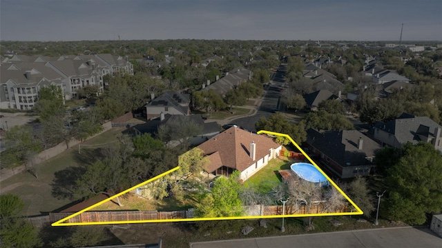 birds eye view of property with a residential view