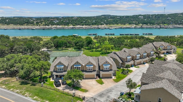 bird's eye view featuring a residential view and a water view