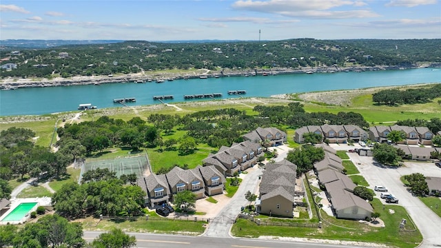 birds eye view of property featuring a residential view and a water view