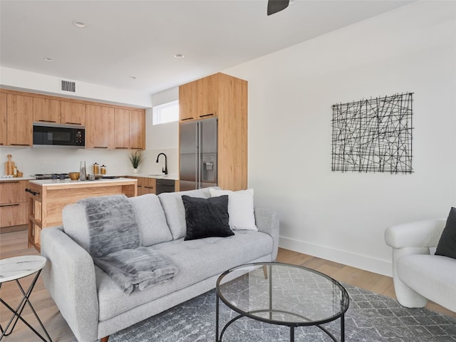 7516 Northcrest Blvd Unit B, Austin, TX 78752 - living area with light wood-type flooring and baseboards