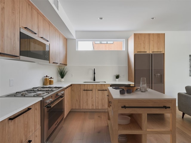 7516 Northcrest Blvd Unit B, Austin, TX 78752 - kitchen with high end range, refrigerator with ice dispenser, a sink, and modern cabinets