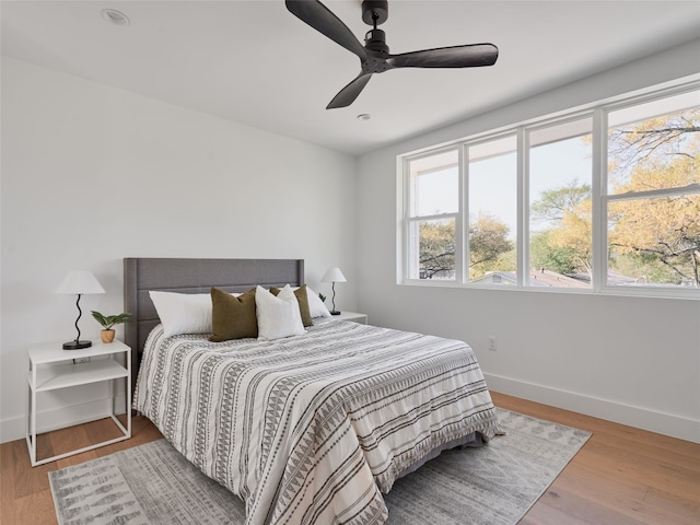 7516 Northcrest Blvd Unit B, Austin, TX 78752 - bedroom with baseboards, wood finished floors, a ceiling fan, and recessed lighting