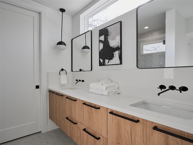 7516 Northcrest Blvd Unit B, Austin, TX 78752 - full bathroom featuring speckled floor, double vanity, and recessed lighting