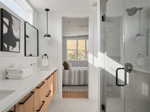 7516 Northcrest Blvd Unit B, Austin, TX 78752 - ensuite bathroom featuring double vanity, a shower stall, and speckled floor