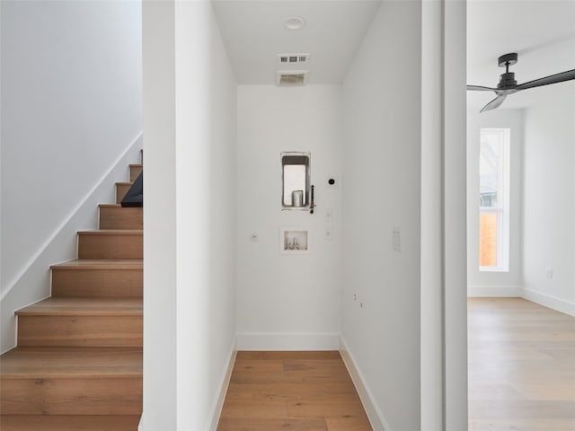 7516 Northcrest Blvd Unit B, Austin, TX 78752 - staircase with wood finished floors, ceiling fan, and baseboards