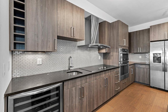 3600 S Lamar Blvd Unit 211, Austin, TX 78704 - kitchen featuring a sink, stainless steel appliances, wine cooler, wall chimney exhaust hood, and decorative backsplash