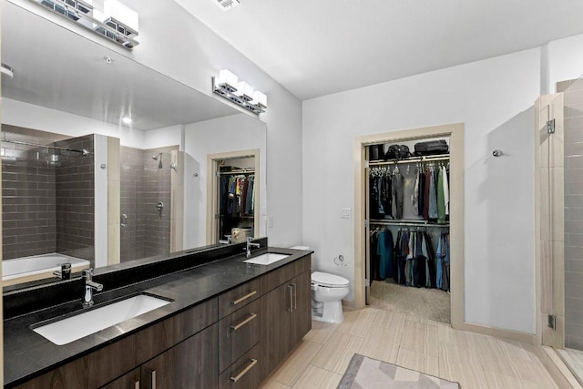 3600 S Lamar Blvd Unit 211, Austin, TX 78704 - full bath with a sink, double vanity, a spacious closet, and a stall shower