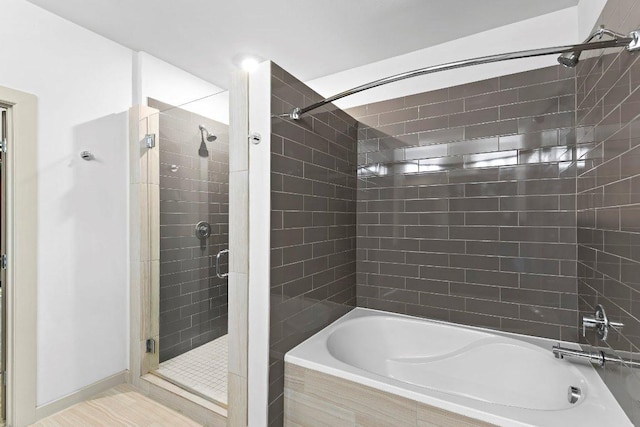 3600 S Lamar Blvd Unit 211, Austin, TX 78704 - full bathroom with tiled shower and tiled tub