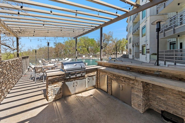 3600 S Lamar Blvd Unit 211, Austin, TX 78704 - view of patio / terrace featuring area for grilling and a pergola