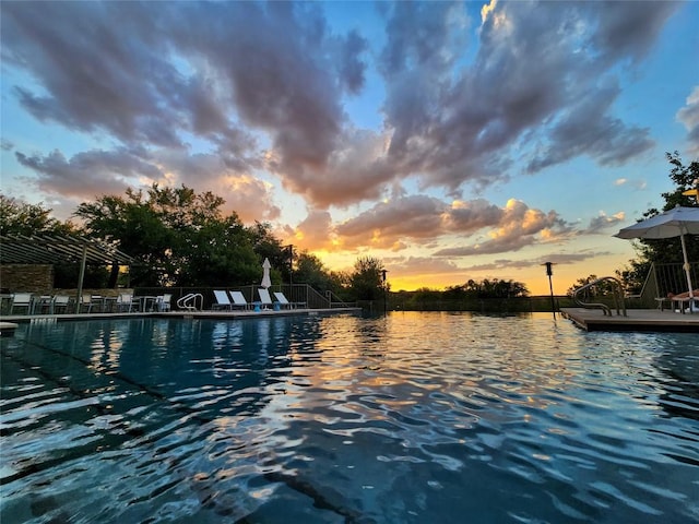 3600 S Lamar Blvd Unit 211, Austin, TX 78704 - pool at dusk with a water view