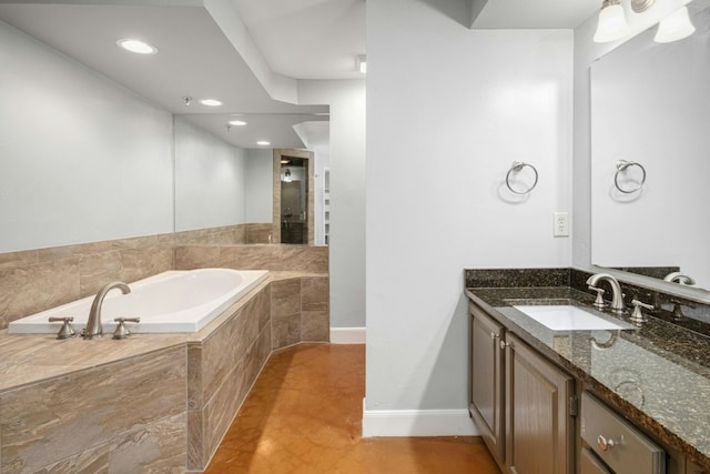 1704 W Ave Unit 108, Austin, TX 78701 - bathroom with a bath, vanity, recessed lighting, and baseboards