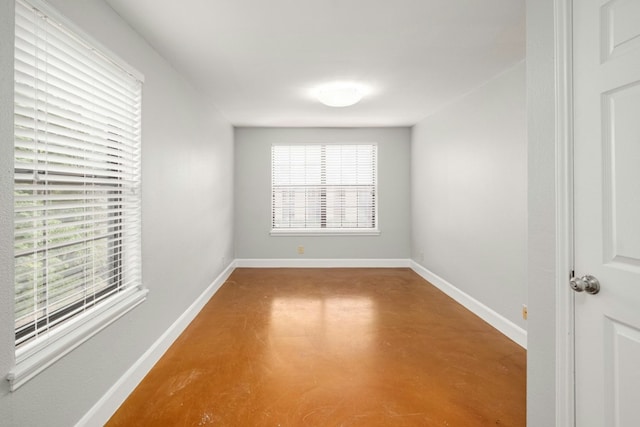 1704 W Ave Unit 108, Austin, TX 78701 - empty room with finished concrete flooring and baseboards