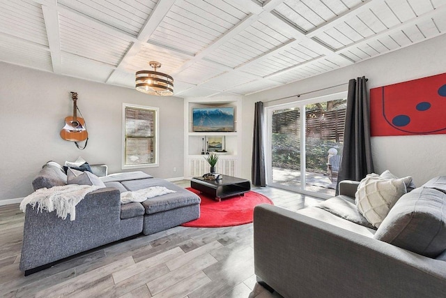 7067 Comanche Trl, Austin, TX 78732 - living area featuring wood finished floors, wood ceiling with exposed beams, and baseboards