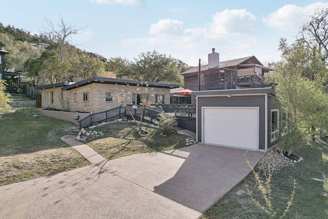 7067 Comanche Trl, Austin, TX 78732 - view of front of home featuring driveway, a garage, and a front yard