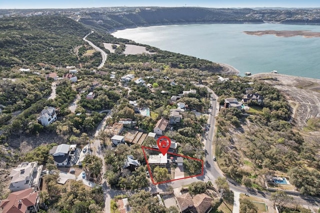 7067 Comanche Trl, Austin, TX 78732 - aerial view of property and surrounding area with a large body of water and property boundaries highlighted
