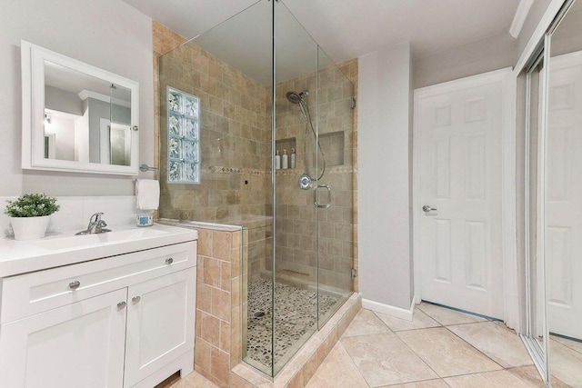 7067 Comanche Trl, Austin, TX 78732 - bathroom featuring a shower stall, vanity, and tile patterned floors