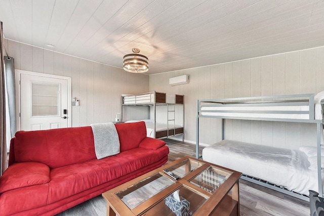 7067 Comanche Trl, Austin, TX 78732 - living room featuring wood finished floors, wooden ceiling, wooden walls, and a wall mounted air conditioner