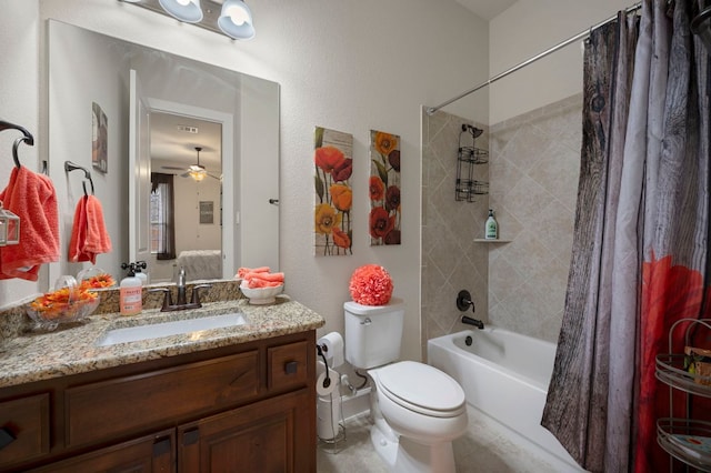 2429 Carretera Dr, Leander, TX 78641 - bathroom with shower / bath combo with shower curtain, vanity, toilet, and ceiling fan