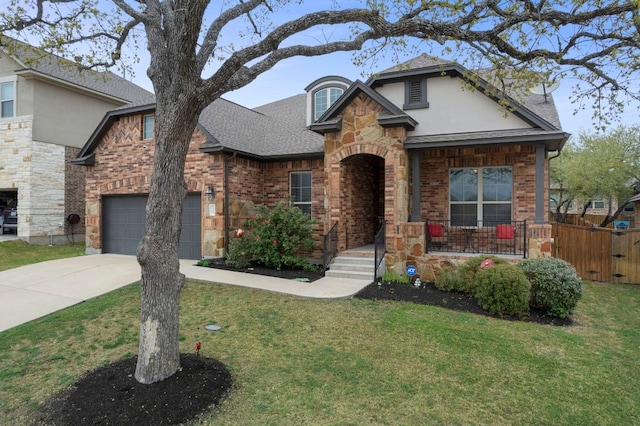 2429 Carretera Dr, Leander, TX 78641 - view of front of property with driveway, roof with shingles, brick siding, and a garage