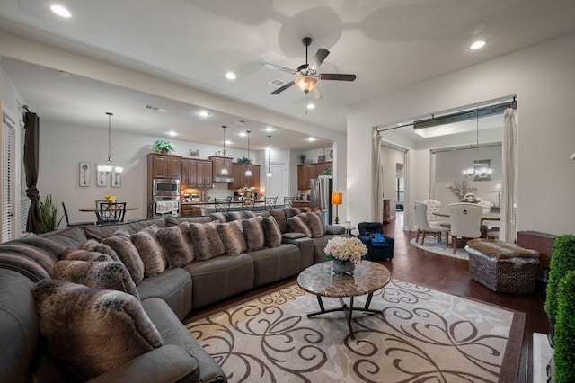 2429 Carretera Dr, Leander, TX 78641 - living room featuring light wood-type flooring, a chandelier, ceiling fan, and recessed lighting