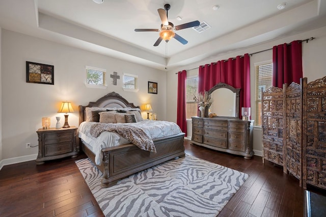 2429 Carretera Dr, Leander, TX 78641 - bedroom with a raised ceiling, hardwood / wood-style floors, baseboards, and ceiling fan