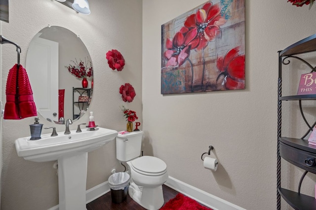 2429 Carretera Dr, Leander, TX 78641 - bathroom with toilet, wood finished floors, and baseboards