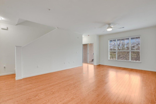 11203 Ranch Road 2222 205, Austin, TX 78730 - unfurnished living room with a ceiling fan, light wood finished floors, baseboards, and ornamental molding