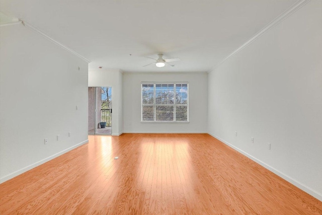 11203 Ranch Road 2222 205, Austin, TX 78730 - unfurnished living room featuring crown molding, ceiling fan, light wood-style flooring, and baseboards