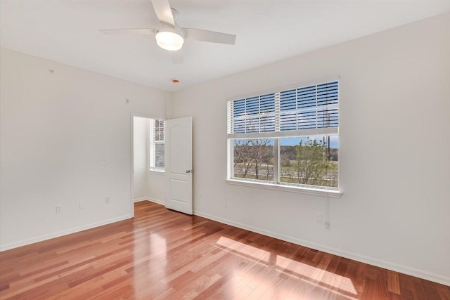 11203 Ranch Road 2222 205, Austin, TX 78730 - spare room featuring light wood finished floors, ceiling fan, and baseboards