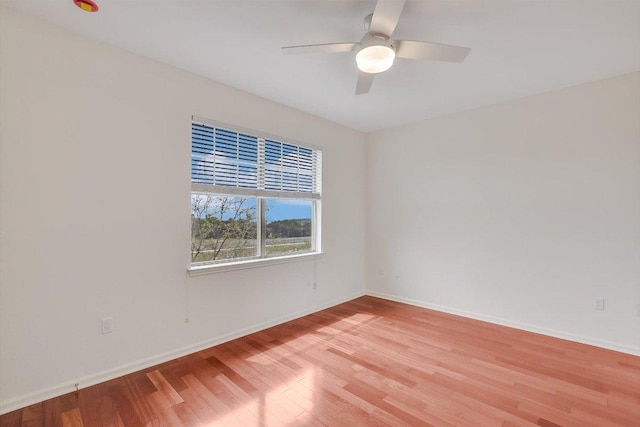 11203 Ranch Road 2222 205, Austin, TX 78730 - unfurnished room featuring light wood-style flooring, baseboards, and a ceiling fan