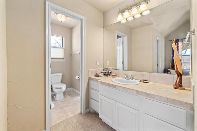 329 Park Place Dr, Georgetown, TX 78628 - bathroom featuring toilet, vanity, and baseboards