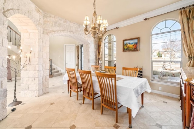 329 Park Place Dr, Georgetown, TX 78628 - dining space with a chandelier, light tile patterned floors, stairway, arched walkways, and ornamental molding